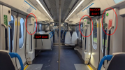 Picture of a class 701 vestibule highlighting what appears to be a retrofitted guard operating panel (labelled GOP) next to the doors on one side of the carriage, and no such panel door on the other side.