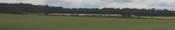 Class 70 pulling a freight train seen from the train to Pontefract Baghill.