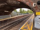 Ewell West station, narrow platform under a bridge