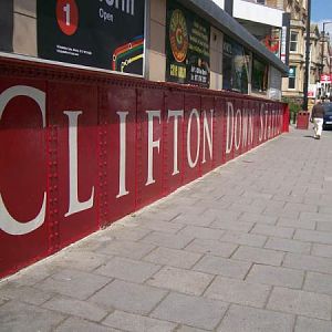 Painted station name on railway bridge under Whiteladies Road