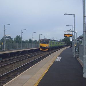 A London Midland service departs Warwick Parkway for Snow Hill.