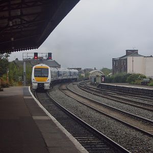 A Chiltern DMU heads south out of the station.
