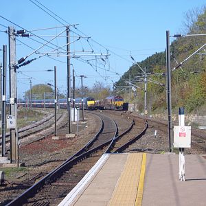 An East Coast HST overtakes a Class 66 in the loop north of Berwick.