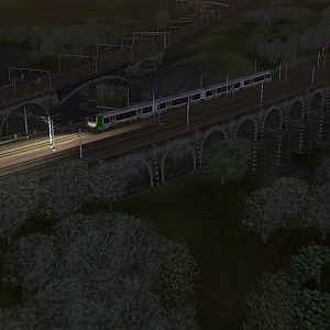 350233 crosses Newhall Viaduct in the evening run with Barton Viaduct in the background