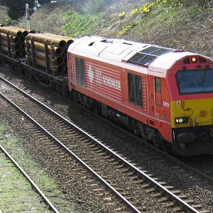 DBS liveried 67018 heads North thro' Arbroath with a pipe train.