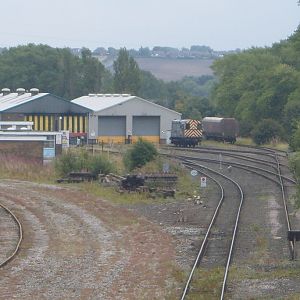 A Class 08 shunter sits outside the shed at Tyne Yard.