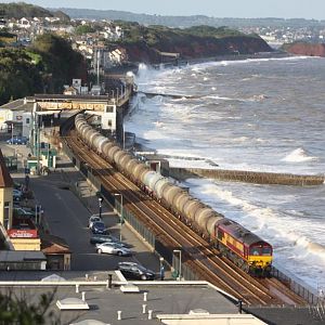 66058 passes though Dawlish on a stormy day