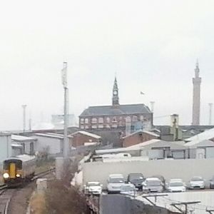 Barton bound train just after leaving Grimsby (Docks). Note the ship left of the Dock Office. This train was very late and caused a First TransPennine