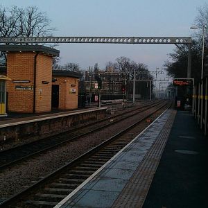 Newley erected stanchions and crossbar at the east end of platform i, Huyton. Taken from platform 1 looking east.