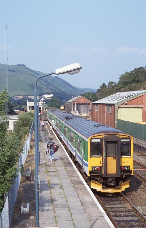 150202 forms the rear unit of a Aberystwyth to Birmingham service at Machynlleth, July 1994.
