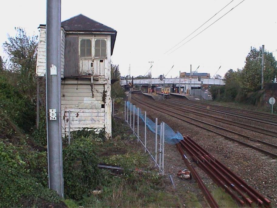 2005, November. Erection of fence between box and railway - fortunately there were points to sidings in front of the box leaving a wide margin where a