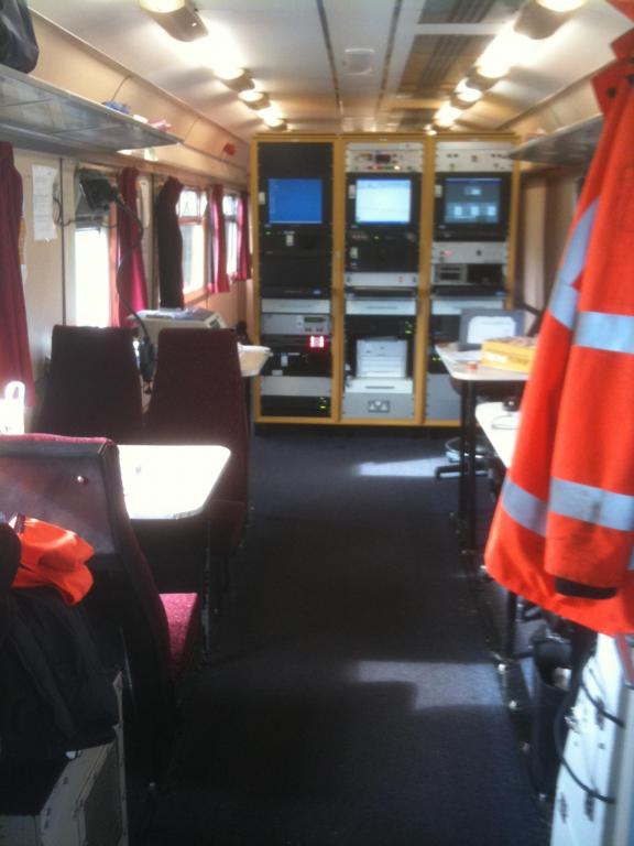 Interior of 999600, the recording coach on 950001 (pre refurb). Racks ahead contain the Track Geometry Computer, Real Time Positioning System manageme