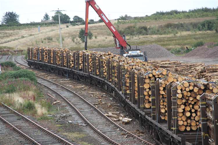 The timber loading facility could take 400 lorries off north roads. Our pic shows timber about to leave Georgemas Junction by rail.